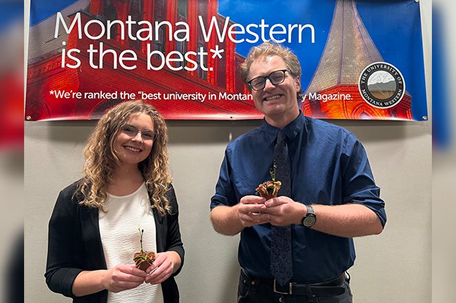 Montana Western student Neleh Bergstrom and Assistant Professor of Biology Dr. Paul Helfrich with Venus flytrap at UMW research symposium.