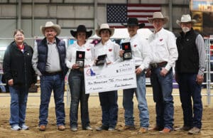 UMW Natural Horsemanship program receiving first place check for Road to the Horse colt starting competition.