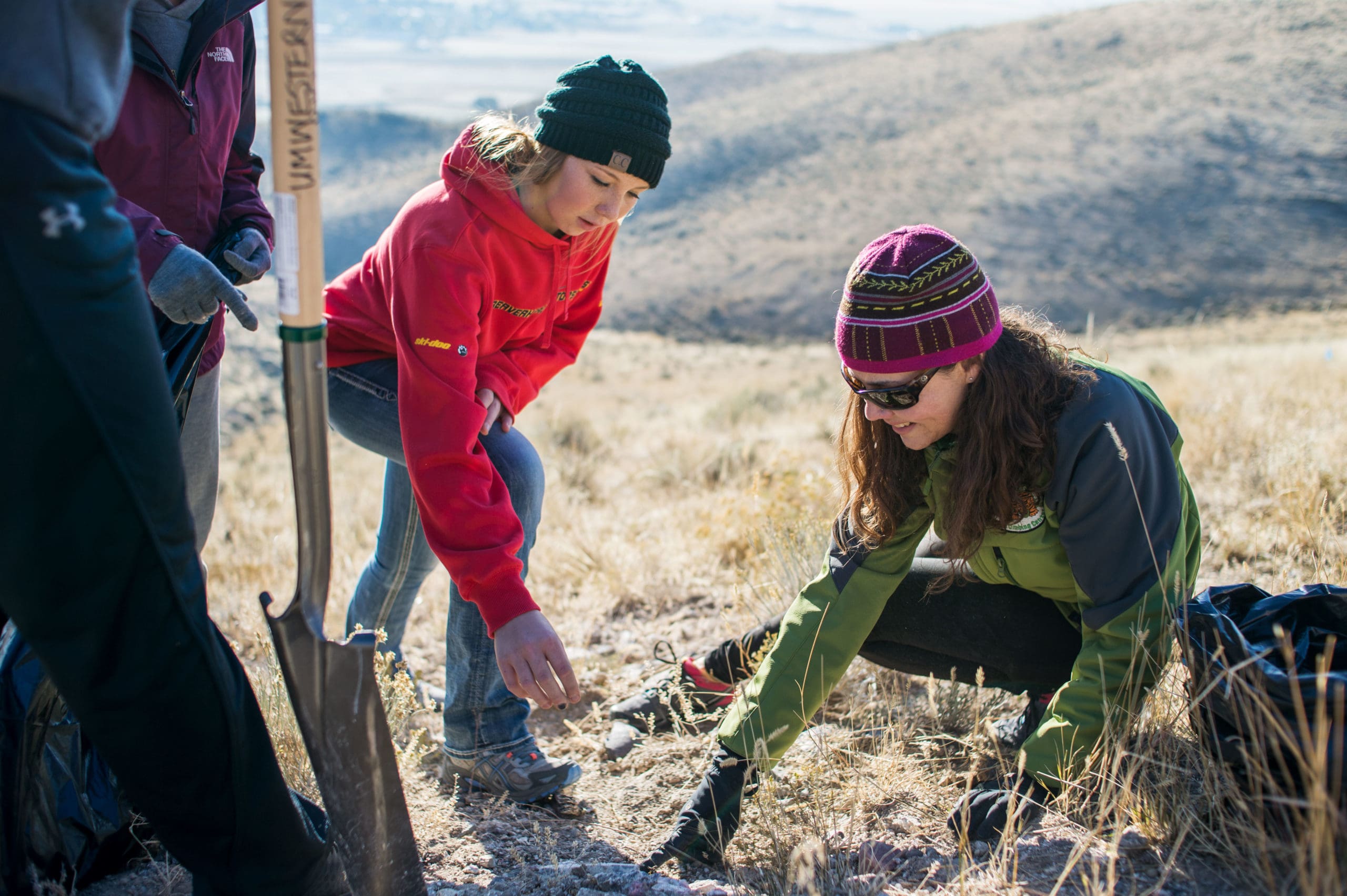 University of Montana Western professor with students conducting a plant study near Dillon, MT, in the field.